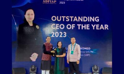 LANDBANK President and CEO Cecilia Cayosa Borromeo (center) receives the Outstanding CEO Award 2023 from ADFIAP Chairman Mominul Islam (right) and Royal Government of Cambodia delegate and ARDB Bank CEO Dr. Kao Thach (left) at the ADFIAP Development Awards in Almaty, Kazakhstan.