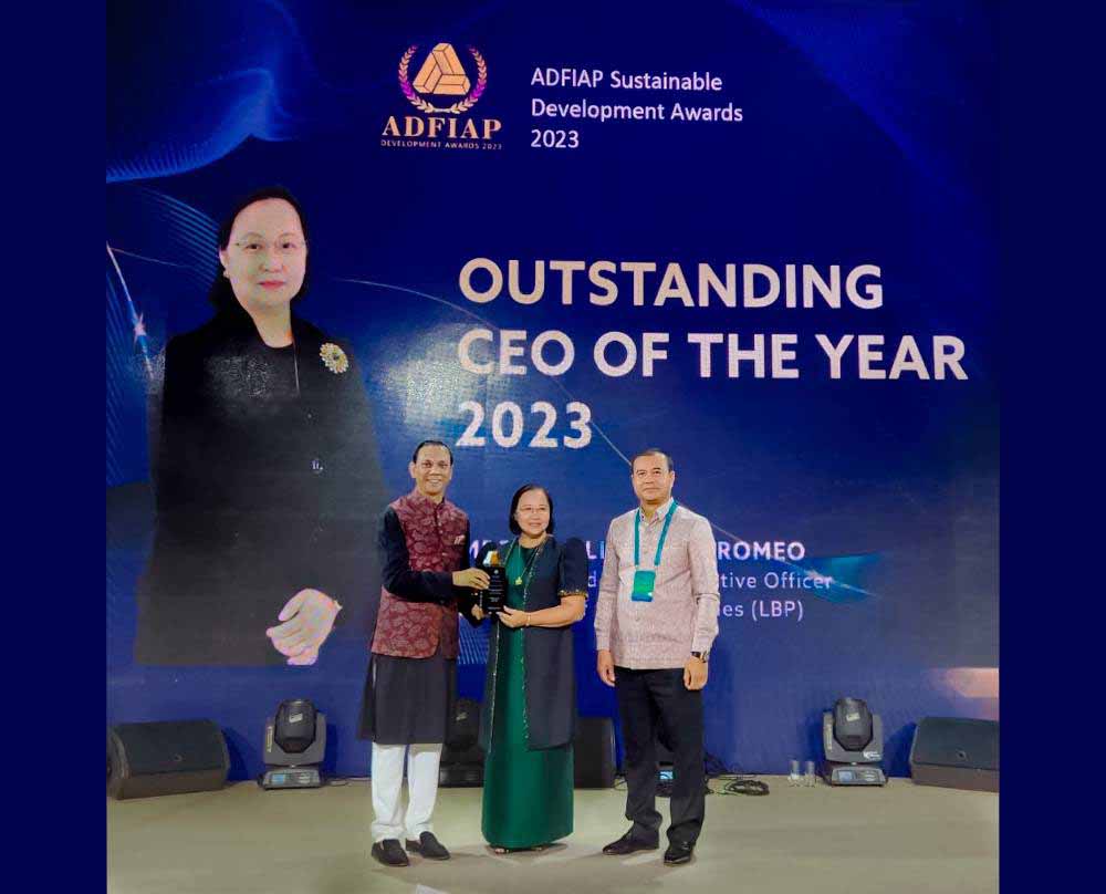 LANDBANK President and CEO Cecilia Cayosa Borromeo (center) receives the Outstanding CEO Award 2023 from ADFIAP Chairman Mominul Islam (right) and Royal Government of Cambodia delegate and ARDB Bank CEO Dr. Kao Thach (left) at the ADFIAP Development Awards in Almaty, Kazakhstan.